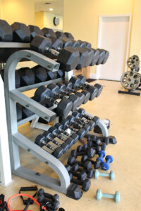 Image of the free weights rack at Rx Fitness